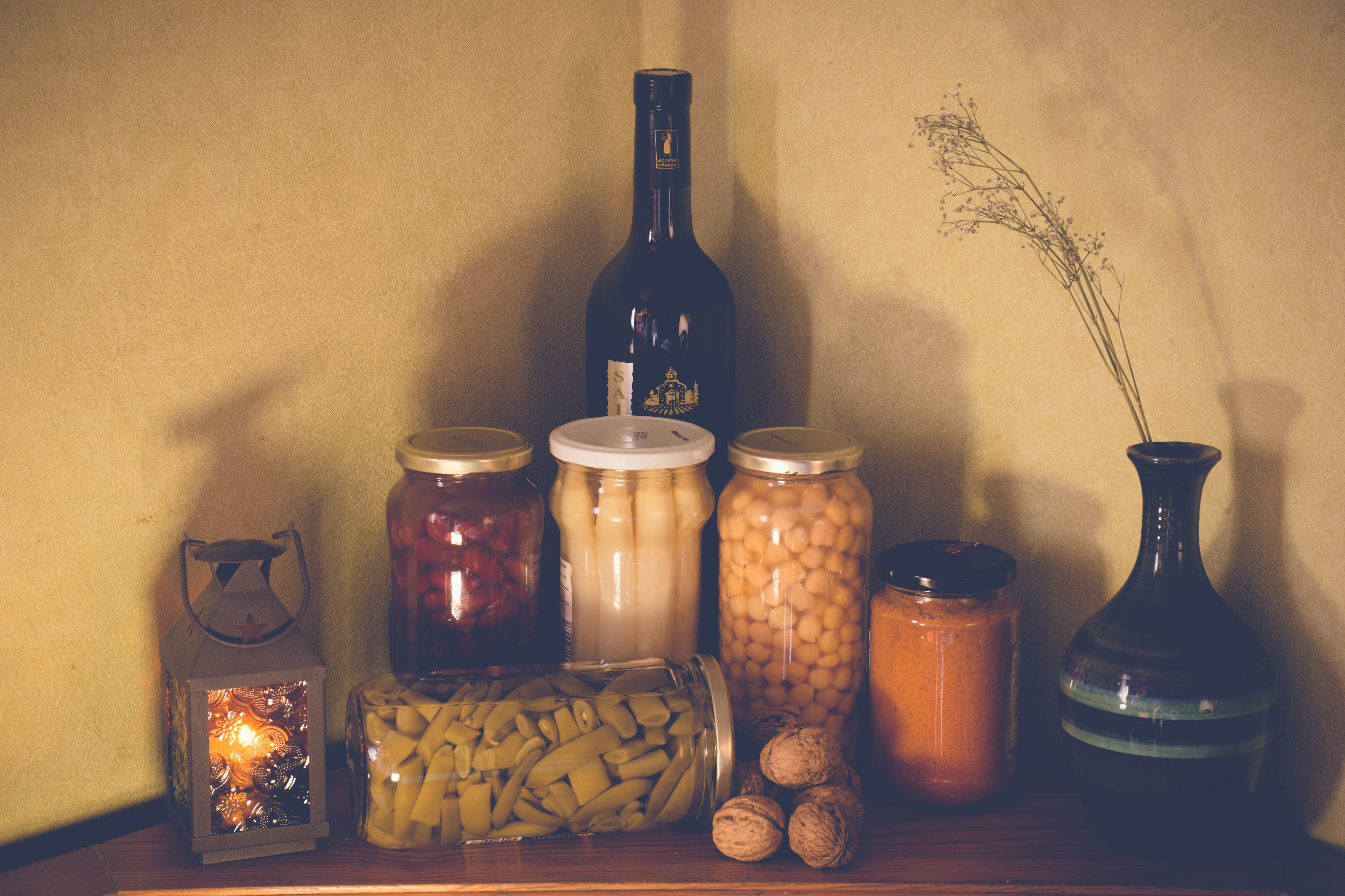 clear glass jars with brown and black liquid inside